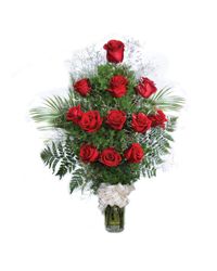 композиция из красных роз и зелени